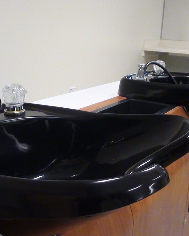 A black backwash basin at the washing station