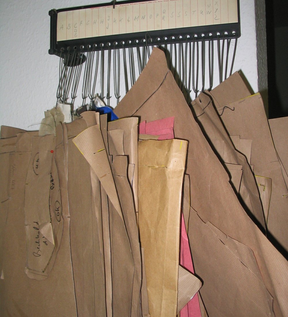 Paper patterns hanging in the atelier