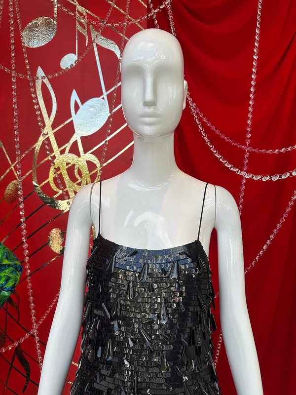A little black dress on a mannequin in a shop window