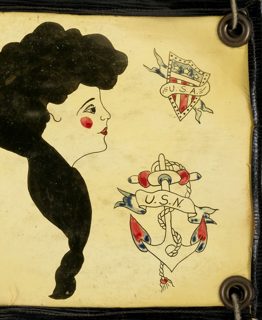 A hand-painted flash sheet: a lettered anchor, a second anchor, shields and a profile in silhouette.
