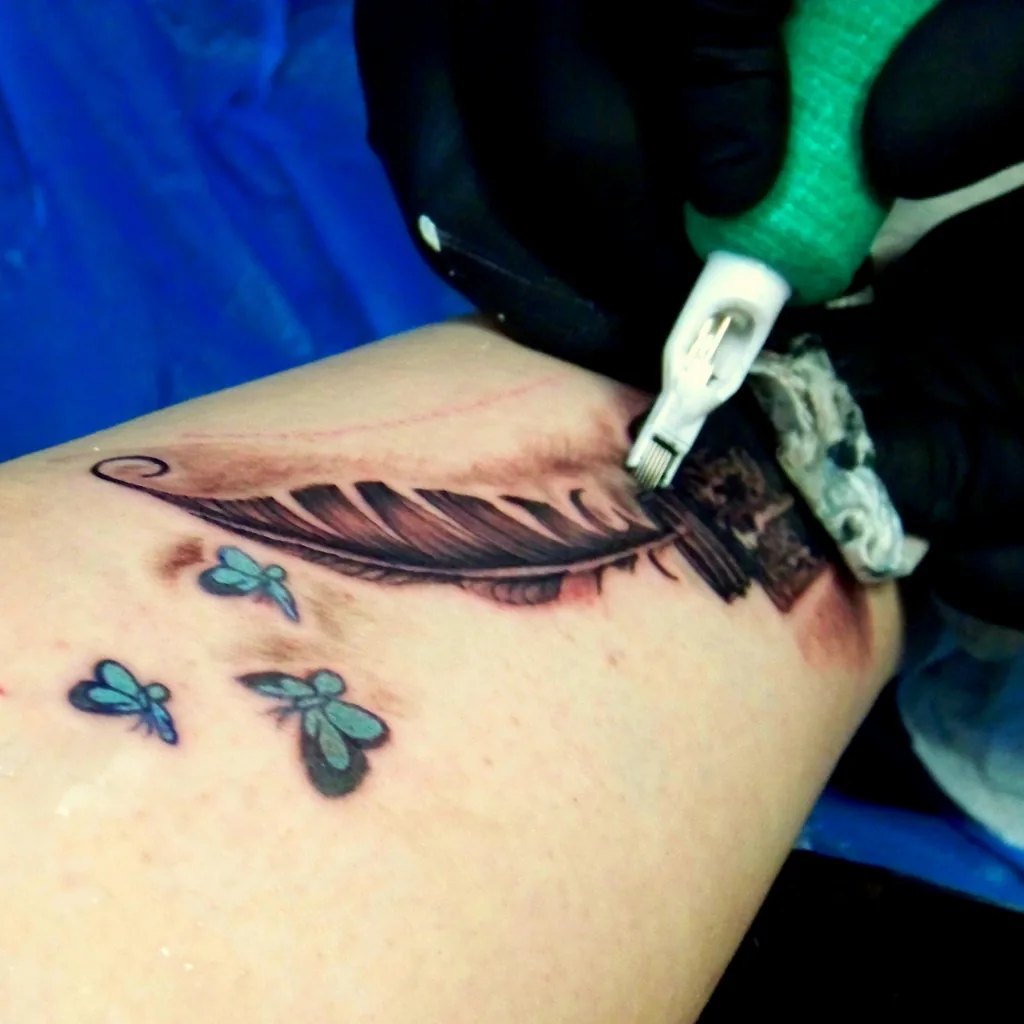 A feather outline under the machine
