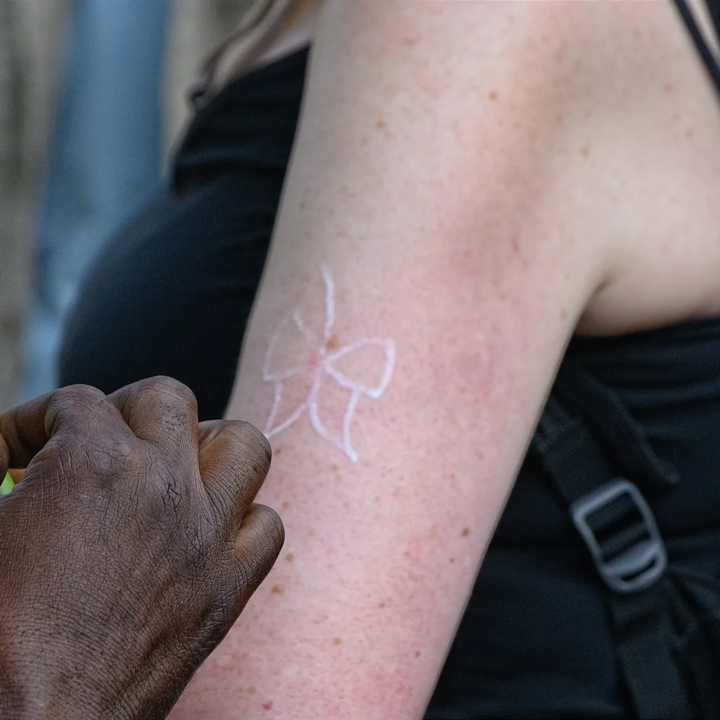 A freehand stencil drawn onto the arm