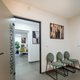 Waiting-area chairs beside a consulting-room door