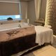 Draped treatment bed in a quiet lounge
