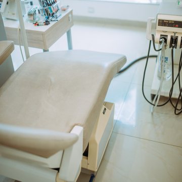 Treatment chair beside an instrument tray