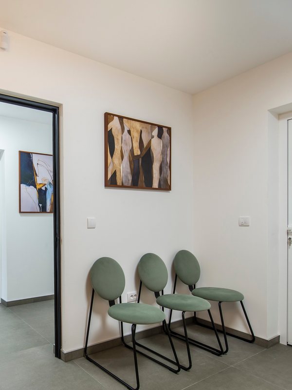 A waiting area leading through to the treatment rooms
