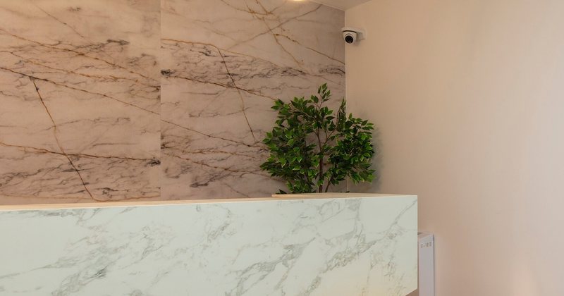 The marble reception desk at one of our clinics