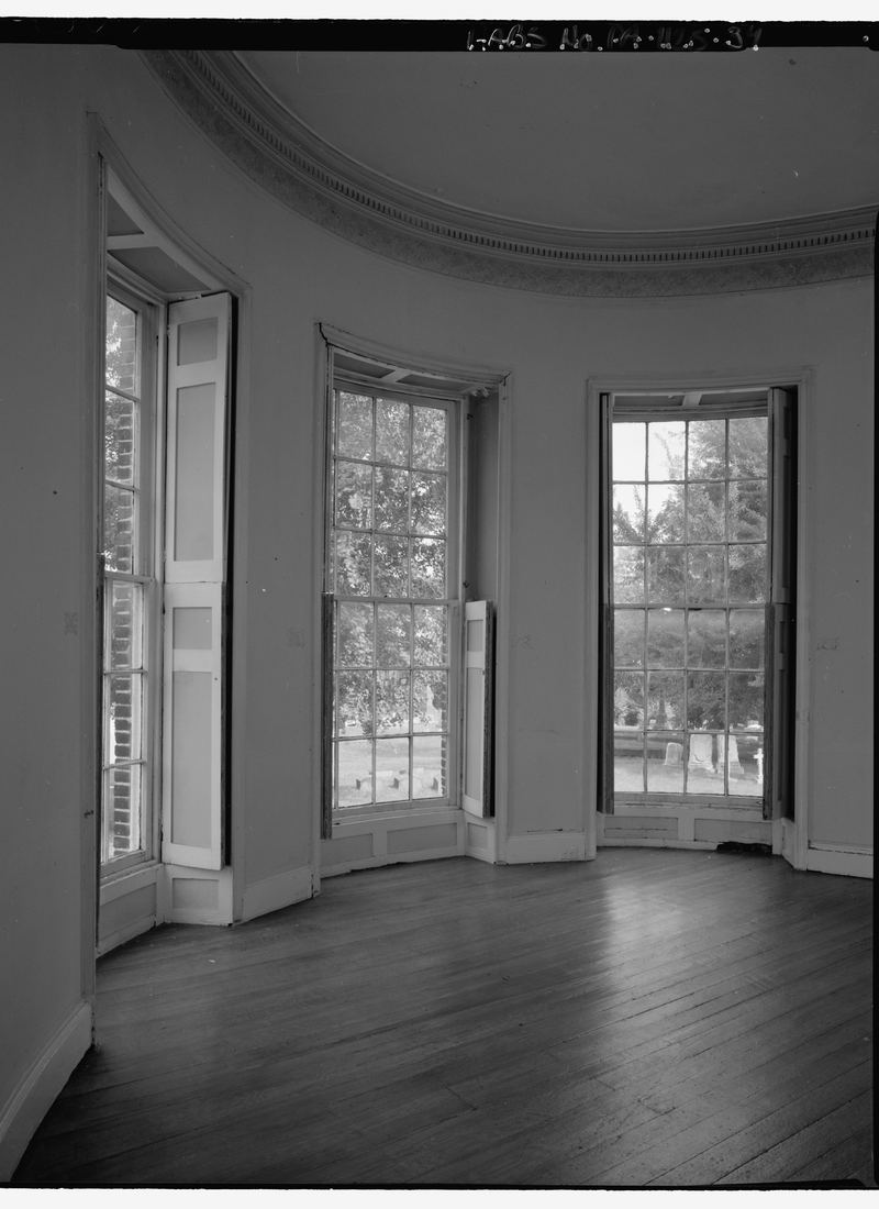 A drawing room window bay in close detail, the shutters, sash and panelled reveal all in one frame.