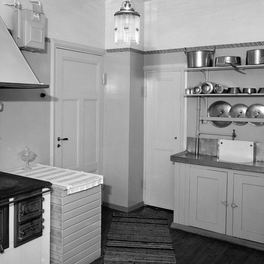 Office detail: a black cast-iron range set into a period kitchen chimney breast.