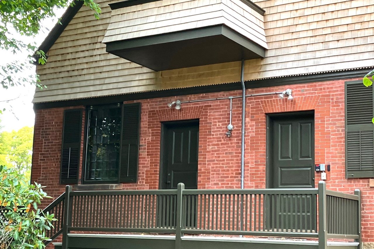 Timber decking and shingle siding on a well-kept coastal home