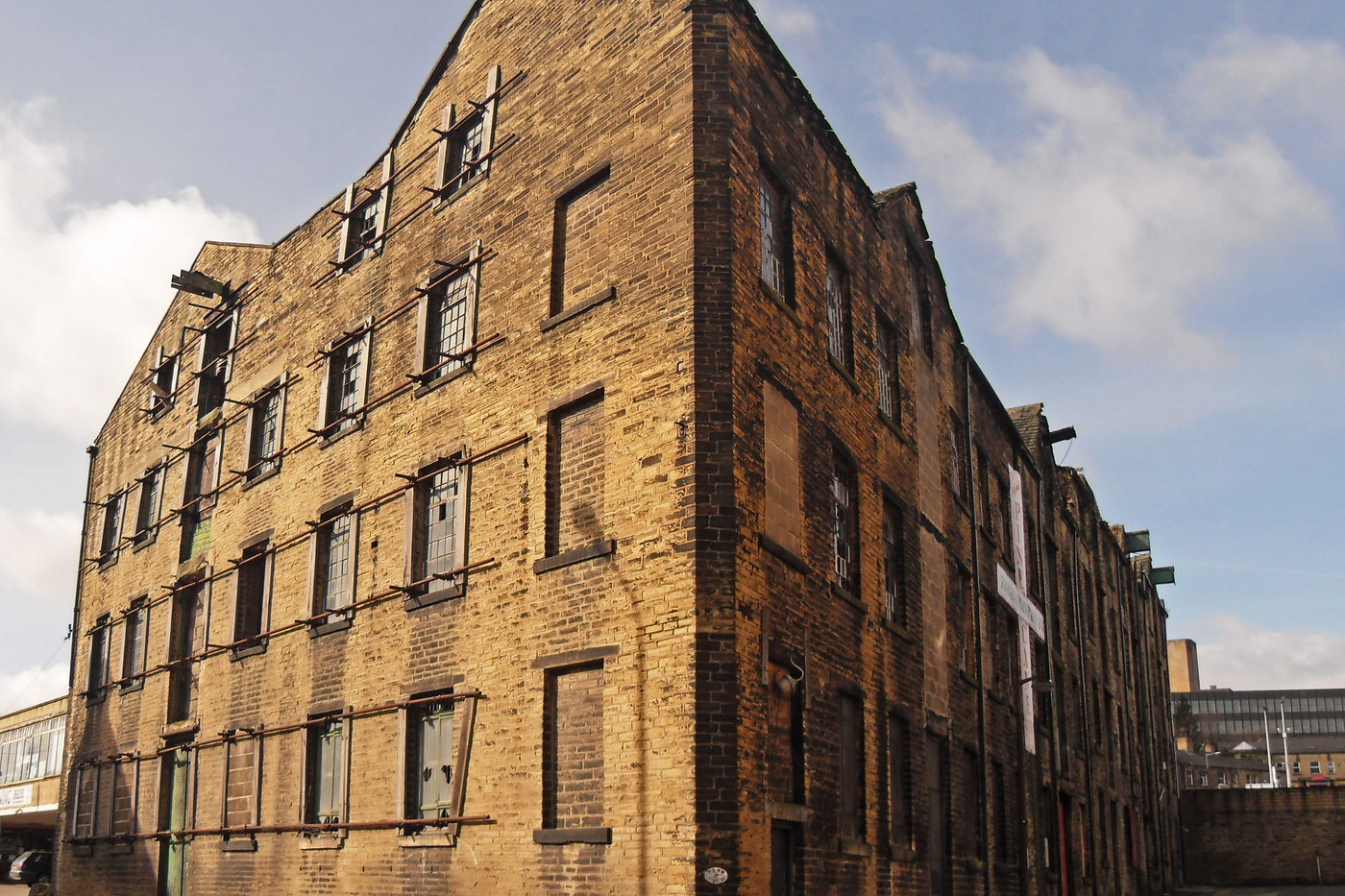 Converted brick warehouse with tall arched windows