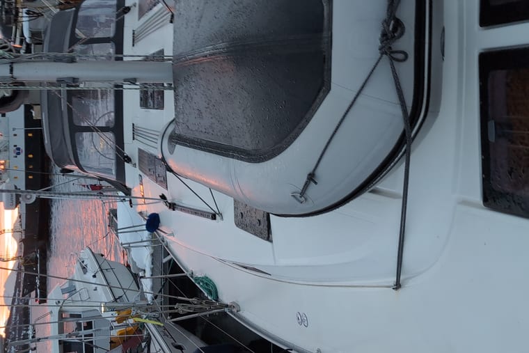 Foredeck hardware and a closed hatch on a white deck.