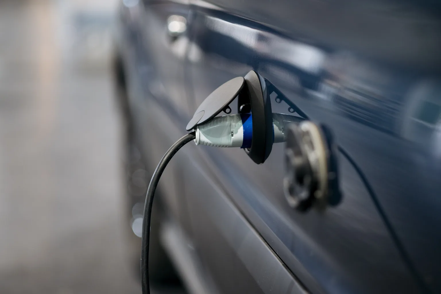 Charging lead plugged into an electric car after a home charge point commissioning