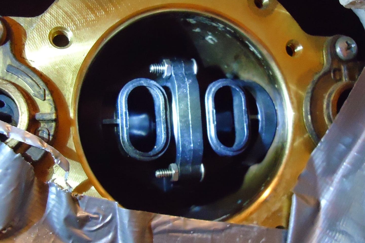 A new shower mixing valve seated in a wall recess with its supply pipes connected on either side