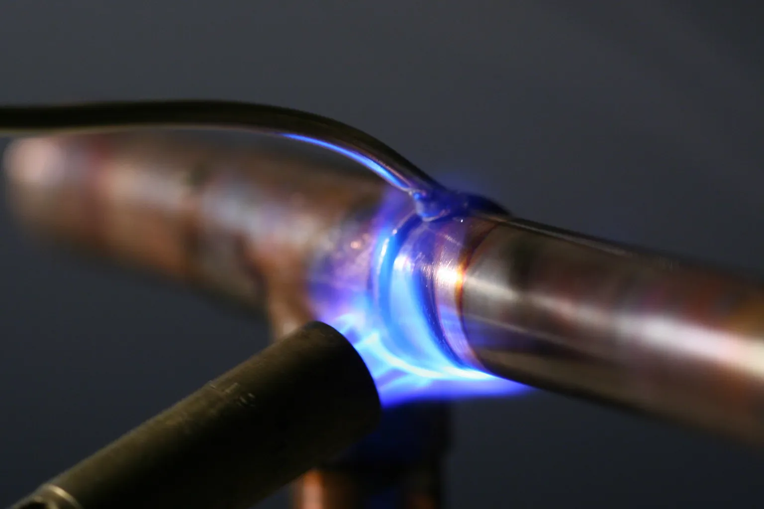 Copper supply joint being soldered with a torch on a drained line