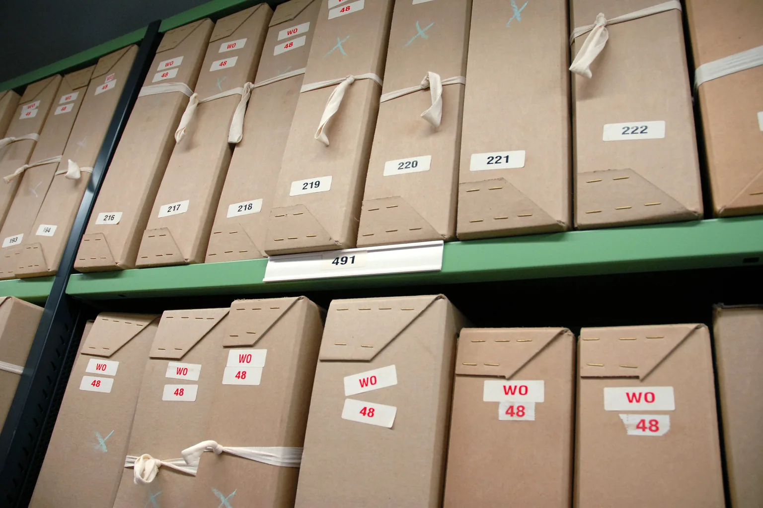 Wide view of labelled document boxes on archive shelving