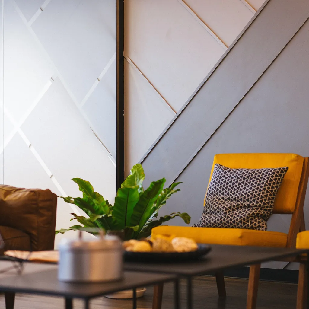 Empty consultation corner with armchairs and a low table