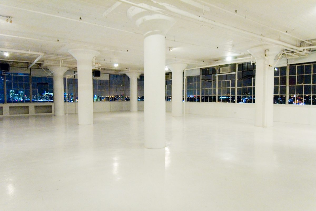 Empty loft reception room lit at night before the guests arrive