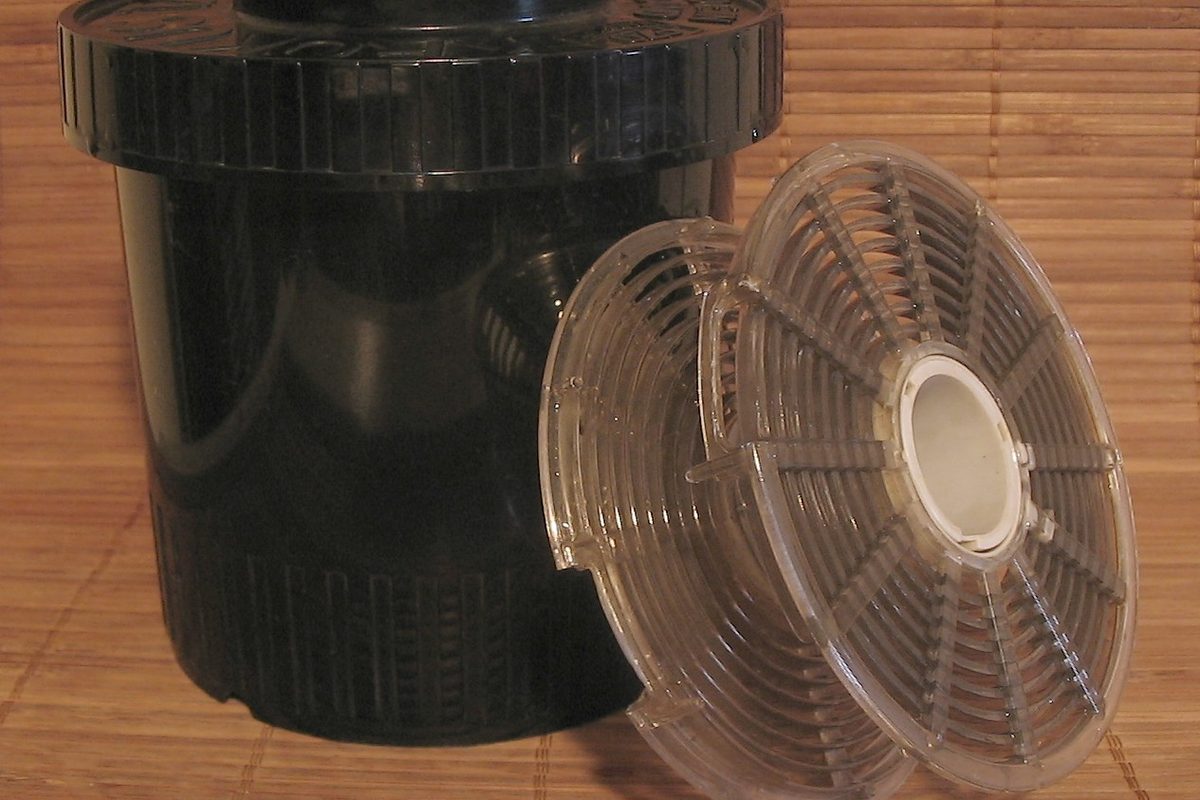 Developing tank with its film reels beside it