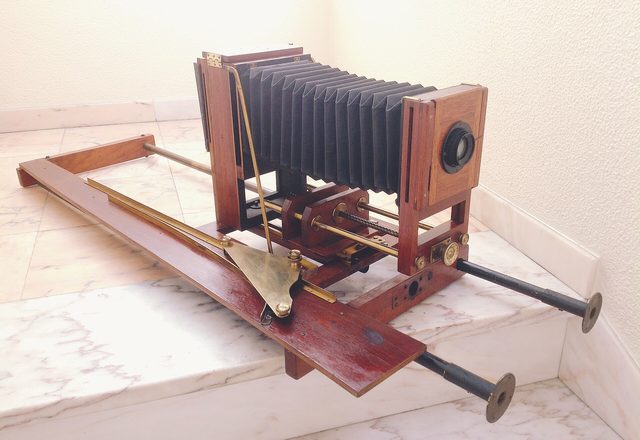 Antique wooden bellows enlarger on its rail