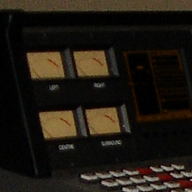 Four VU meters in a row on a console.
