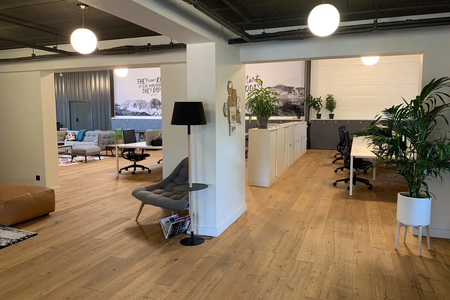 Entry floor with reception counter, lounge seating and meeting zone beyond