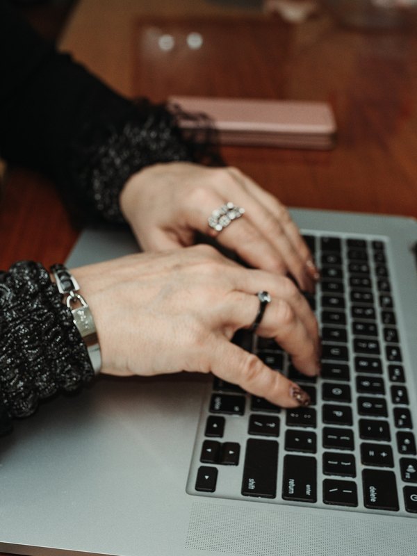 A member typing at one of the shared tables