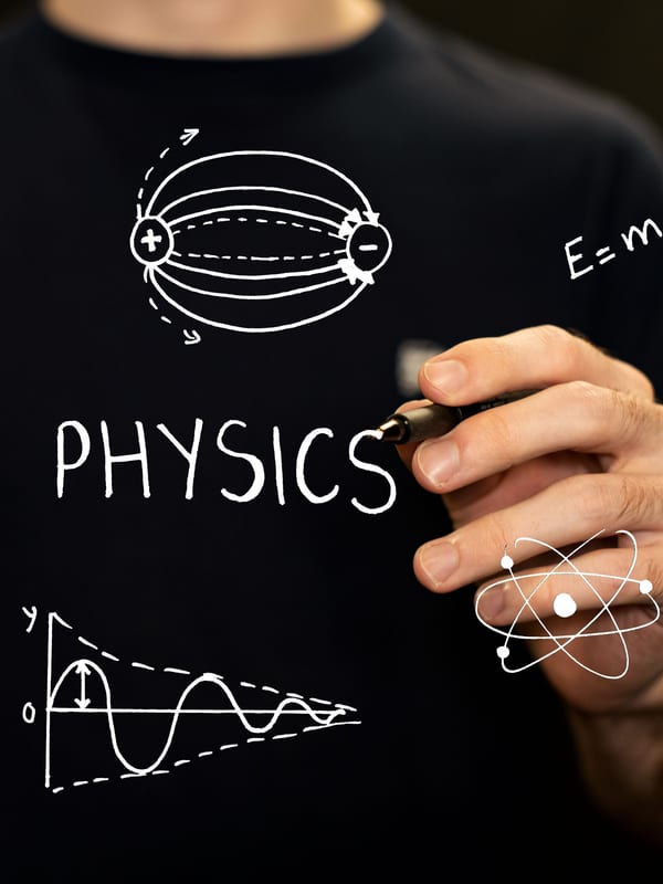 Physics diagrams and a damped-wave graph drawn on a clear board